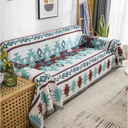 A cozy white throw blanket with teal and maroon geometric patterns and fringed edges decorbites boho chenille woven