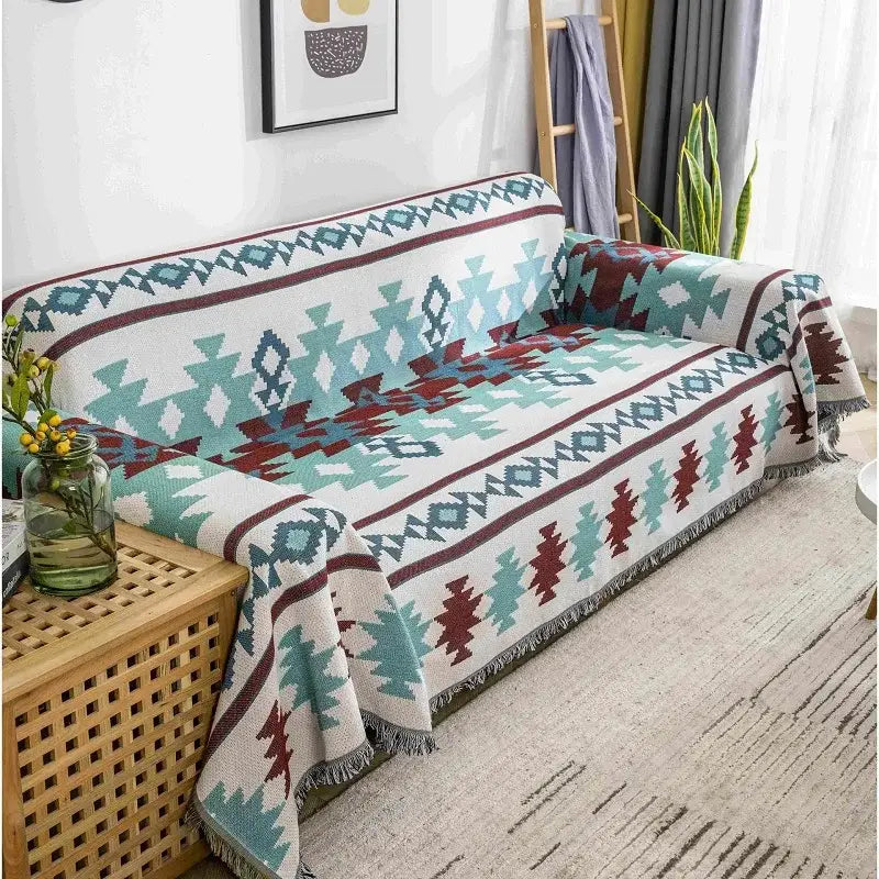 A cozy white throw blanket with teal and maroon geometric patterns and fringed edges decorbites boho chenille woven