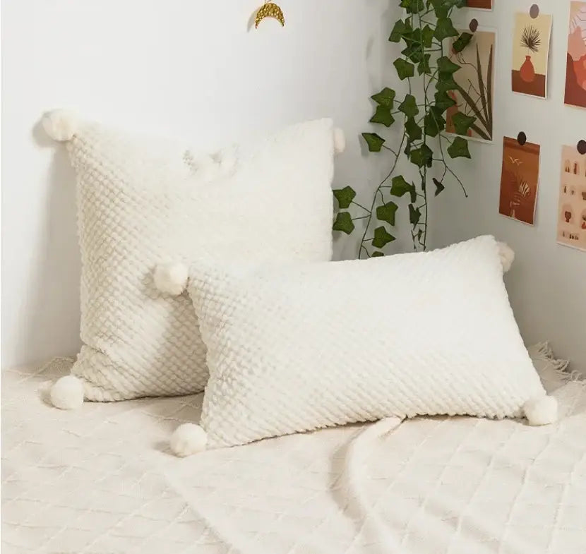 Cream-colored textured cushion cover with fluffy pom-poms for living room decorbites boho loop tufte style decor