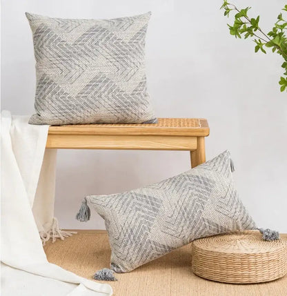 Gray woven cushion cover with geometric chevron pattern and tassels by decorbites boho loop for living room decor