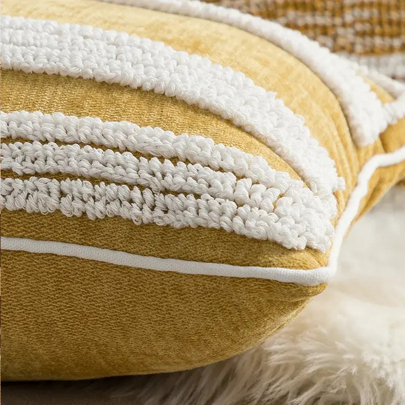 A mustard-yellow cushion cover with textured white crochet stripes and stitched border for decorbites boho loop tufte decor