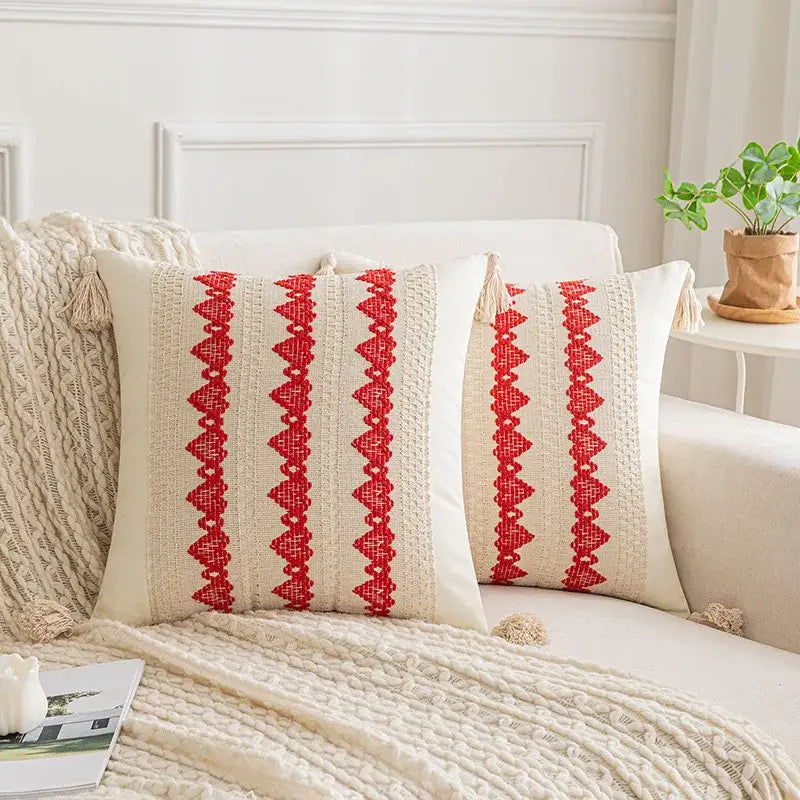 Cream-colored cushion cover with bold red embroidered boho geometric tassel stripes for living room decorbites style
