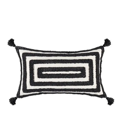 Black and white rectangular cushion cover with textured boho geometric tufted pattern and tassels for living room decor