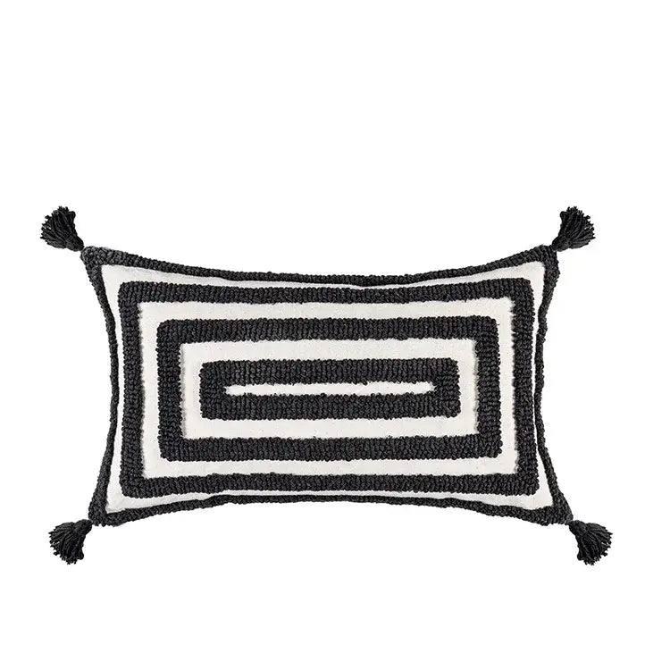 Black and white rectangular cushion cover with textured boho geometric tufted pattern and tassels for living room decor