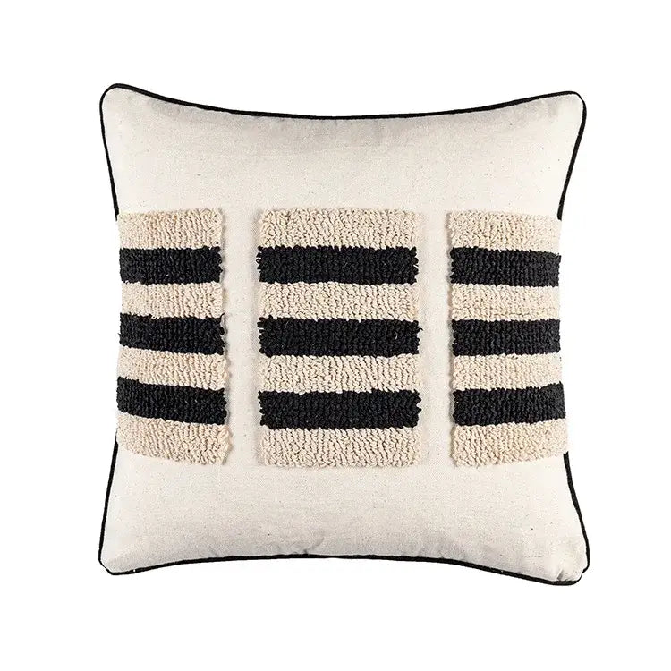 Cream-colored cushion cover with black and cream textured stripes and thin black border decorbites boho geometric tufted design