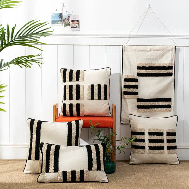 Beige and black textured throw pillows with boho geometric tufted stripes on soft fabric cushion cover for living room decor