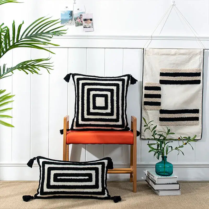 Boho geometric tufted black and cream cushion cover with tassels for living room decor by decorbites