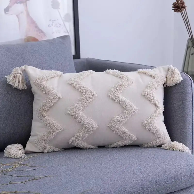 Cream-colored boho geometric tufted cushion cover with textured zigzag fringe and tassels for living room decorbites pillow