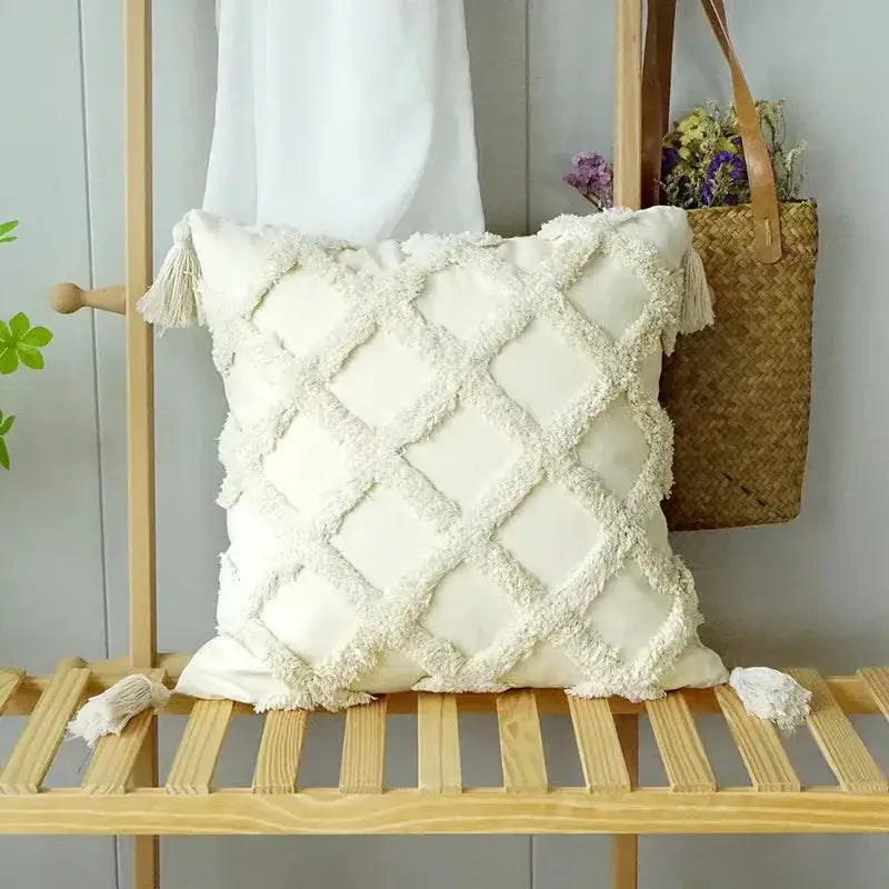 Cream-colored boho geometric tufted cushion cover with textured diamond pattern and fringed tassels for living room decorbites