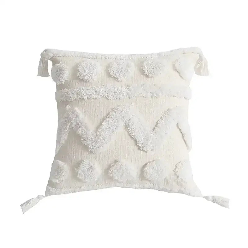Cream-colored decorbites boho geometric tufted cushion cover with textured pom-poms and tassels for living room decor