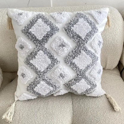White and gray textured boho geometric tufted cushion cover with diamond patterns and cream tassels for living room decor