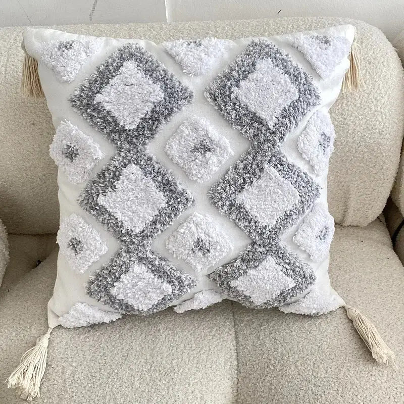 White and gray textured boho geometric tufted cushion cover with diamond patterns and cream tassels for living room decor