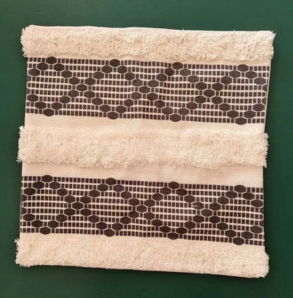Beige boho geometric tufted cushion cover with frayed edges and dark brown patterns for decorbites living room decor