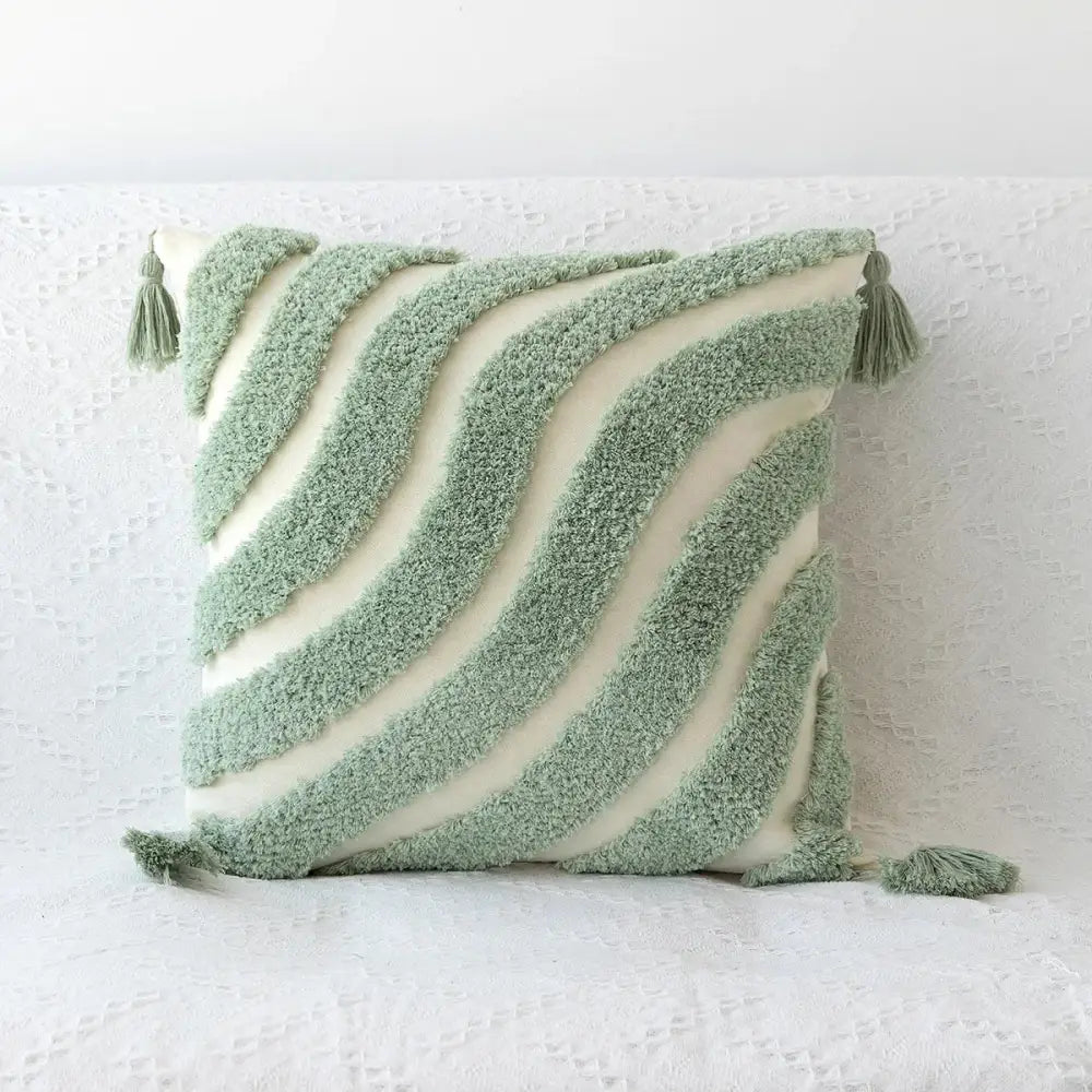 Soft mint green and cream decorbites boho geometric tufted cushion cover with textured wavy stripes and tassels