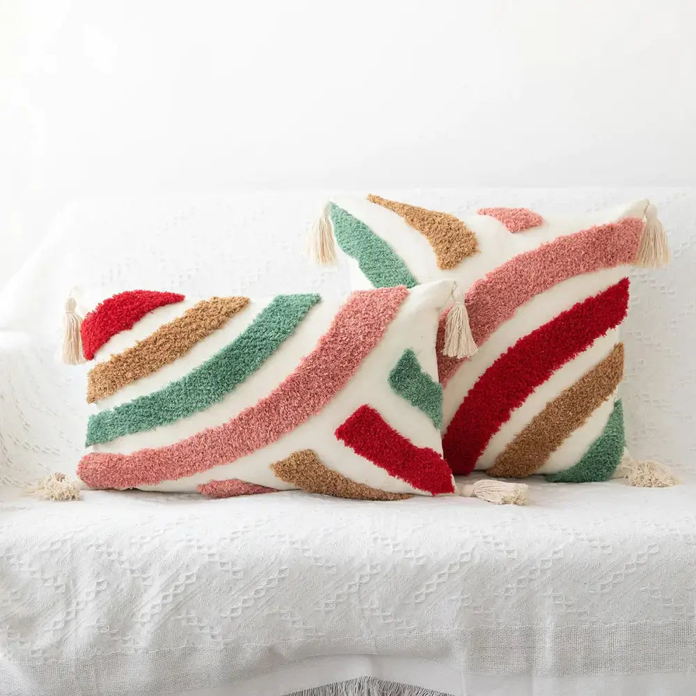 Two plush multicolored striped boho geometric tufted cushion covers with cream tassels for living room decorbites decor