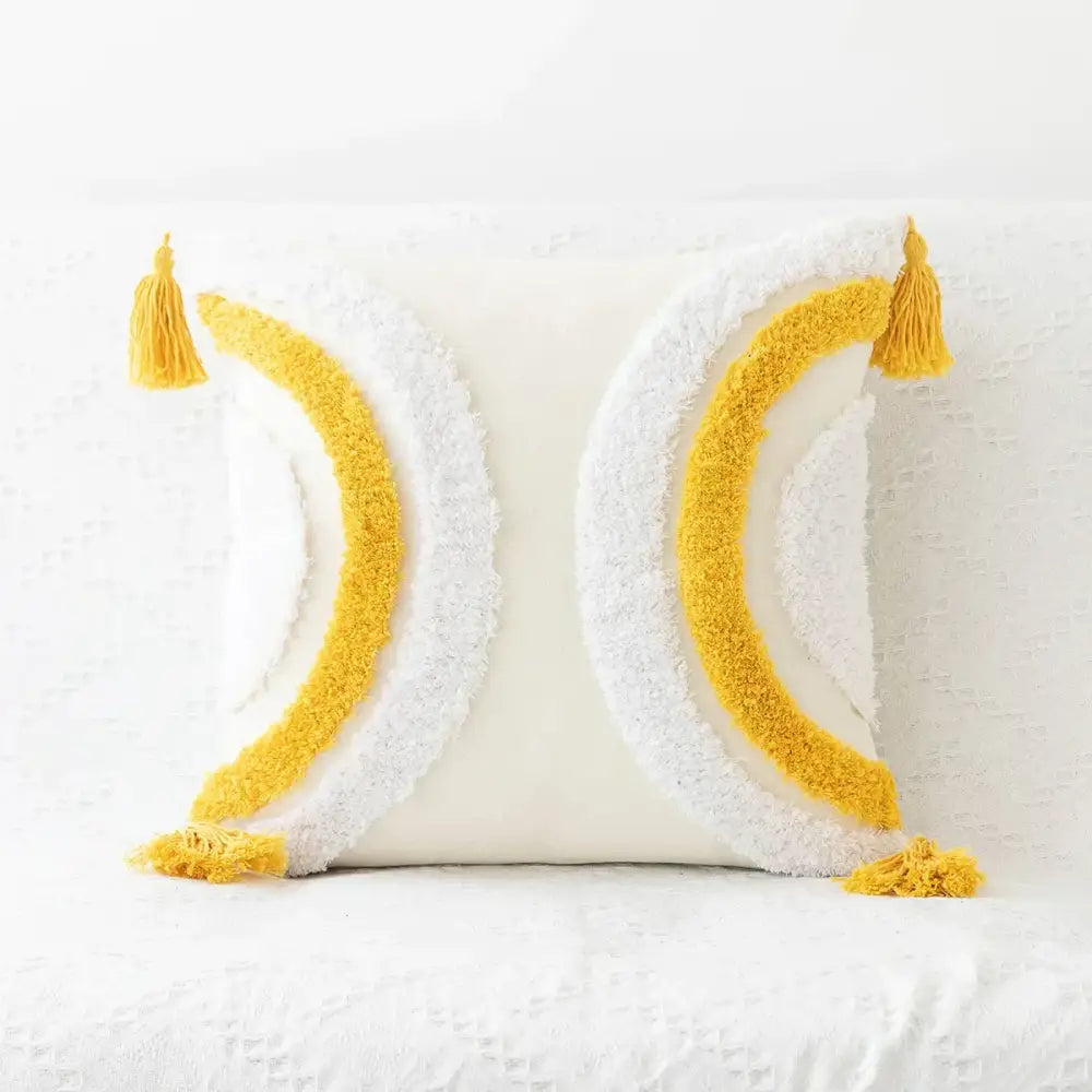 White cushion with textured yellow and white crescent moon patterns and tassels decorbites boho geometric tufted cushion cover