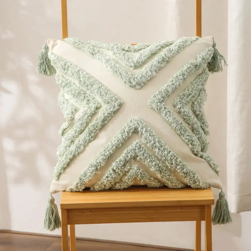 Boho geometric tufted cushion cover in soft mint green and cream with a textured tassel trim for living room decorbites