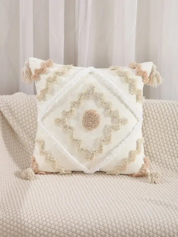 Cream-colored decorbites boho geometric tufted cushion cover with textured beige yarn and tassels for living room decor