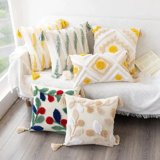Cream-colored cushion cover with yellow green blue tufted embroidery and tassels boho geometric tufted decorbites design