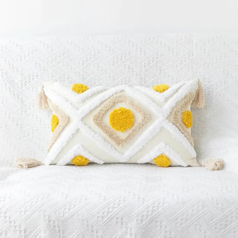 Cream-colored cushion cover with yellow beige geometric tufted embroidery and tassels for boho living room decorbites decor