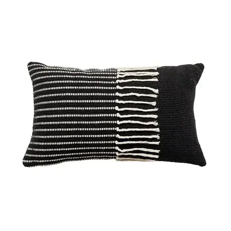 Black and white woven pillow cover with textured knit, vertical stripes, and tassels for boho geometric tufted decorbites set