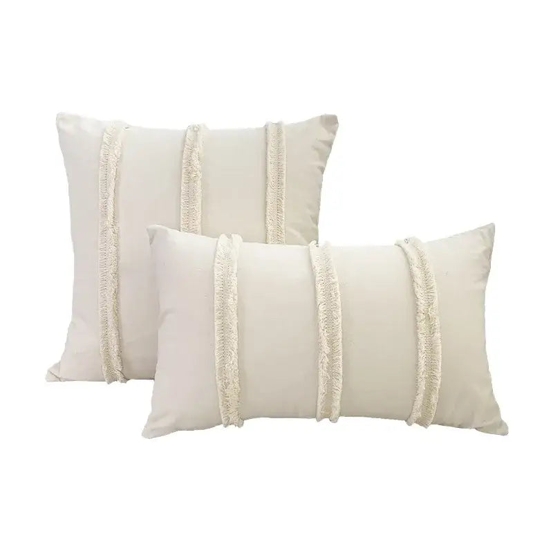 Cream-colored rectangular cushion cover with three vertical fringed fabric strips for decorbites boho geometry style