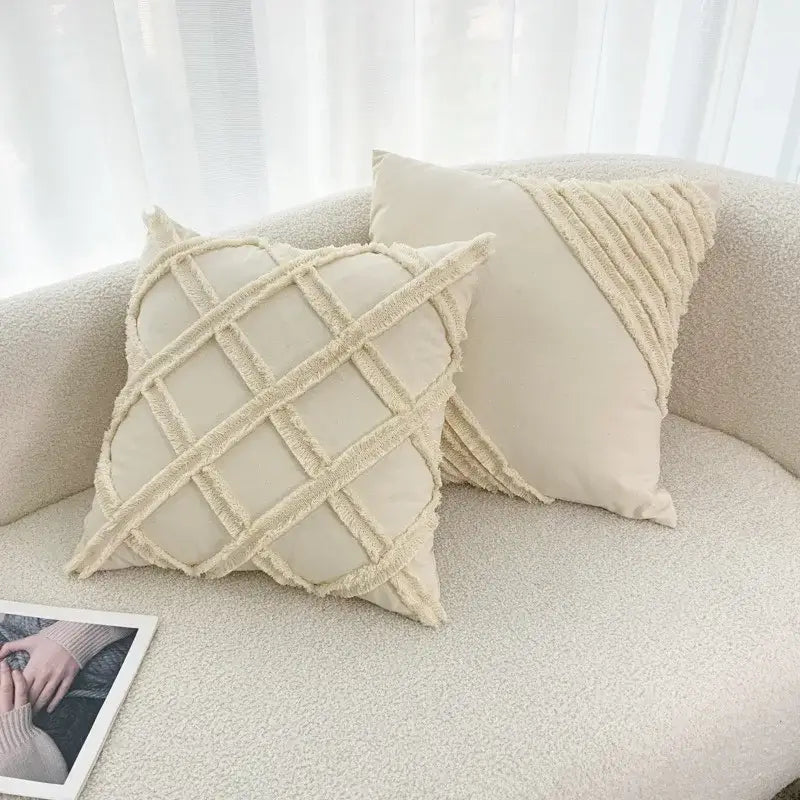 Cream-colored boho geometry fringed cushion cover with textured frayed grid and diagonal fabric accents for living room decorbites