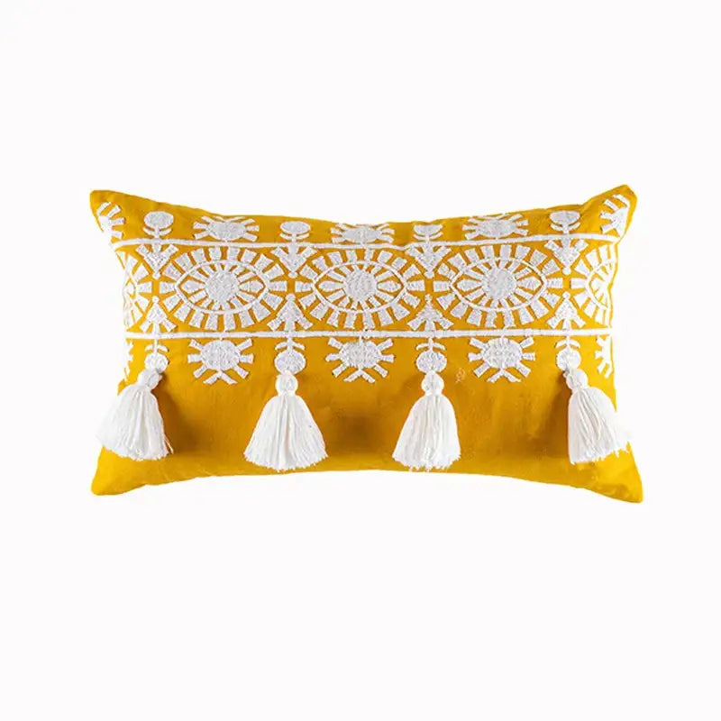 Vibrant yellow cotton pillow cover with intricate white boho gold embroidered patterns and matching tassels decorbites boho gold
