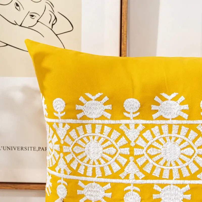 Vibrant yellow boho gold embroidered cotton pillow cover with white sun and geometric patterns for living room decorbites decor