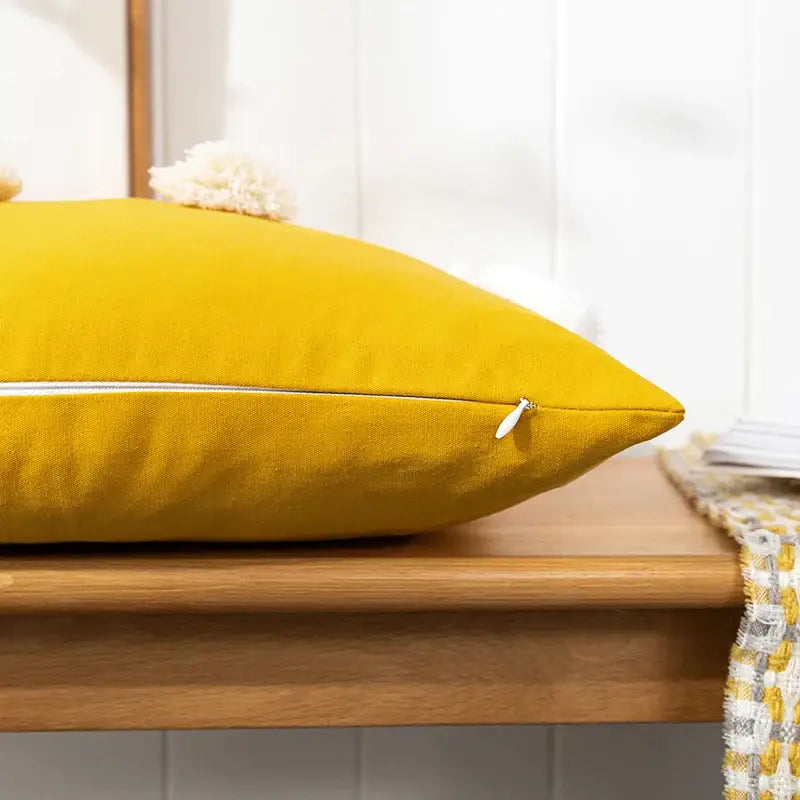 Vibrant mustard yellow linen pillow cover with white zipper and cream pom pom for decorbites boho gold embroidered decor