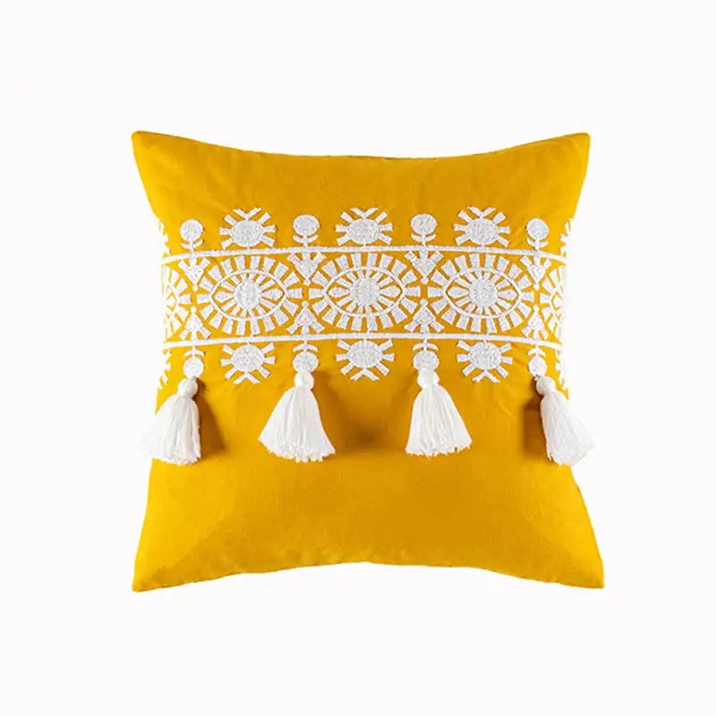 Vibrant yellow cotton pillow cover with boho gold embroidered white patterns and matching tassels for living room decorbites boho gold decor