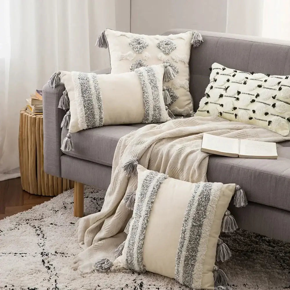 Cream-colored cushion cover with gray textured stripes and tassels for decorbites boho morocco tufted decor