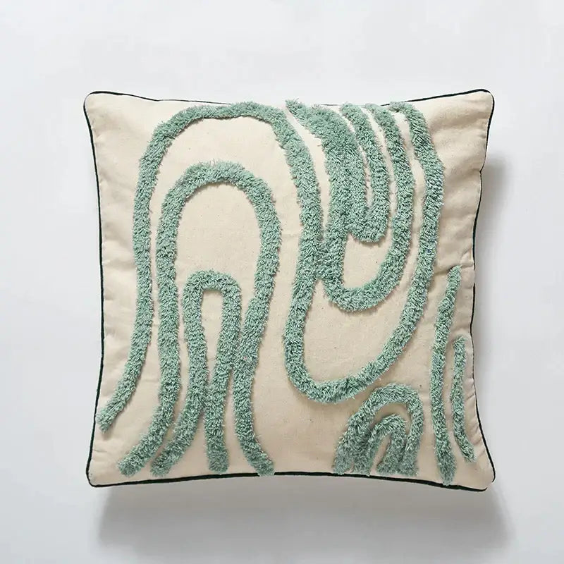 Cream cushion cover with textured mint green embroidered swirls and black border for boho green and cream decorbites blue tufted geometric decor