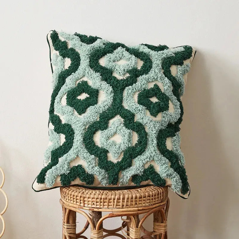 A plush square cushion cover with blue tufted geometric pattern in deep green and light teal yarns for living room decorbites decor