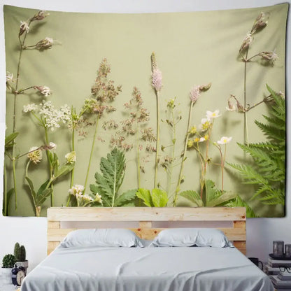 A soft olive green wall tapestry with detailed botanical green leaf print for decorbites boho green leaf decor