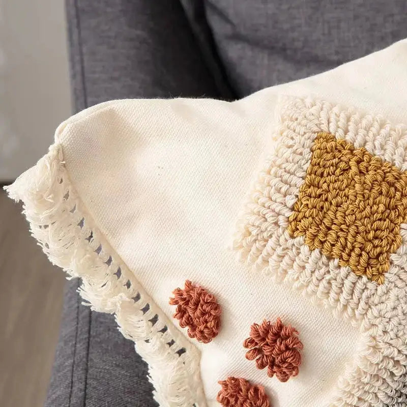 Cream-colored pillow cover with mustard yellow and terracotta crochet details and frayed edges for boho ivory brown decorbites boho ivory