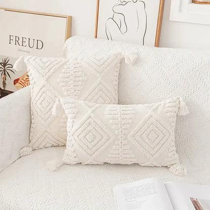 Cream-colored textured cushion cover with geometric embroidery and tassel accents decorbites ivory cotton loop pillow
