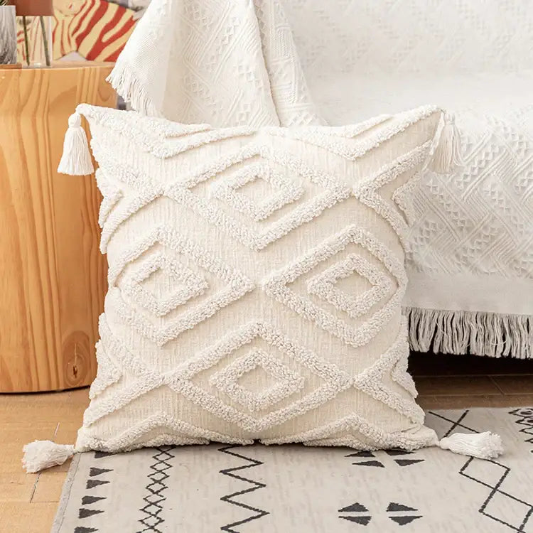 Cream-colored boho ivory cotton loop cushion cover with textured diamond pattern and tasseled decorbites ivory cotton pillow