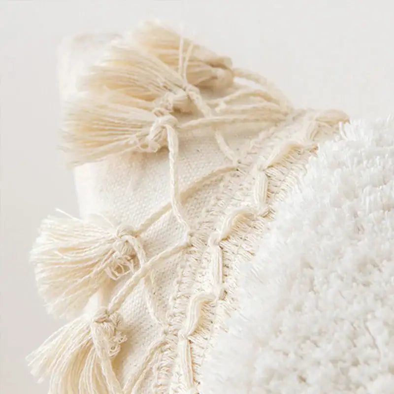 Boho ivory cushion cover with cream-colored textured woven textile and fringed tassels for living room sofa decorbites ivory cushion