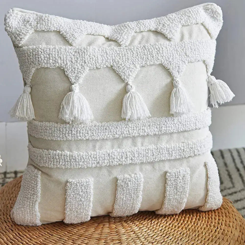 Boho ivory tufted tassel cushion cover with cream fabric, textured white tassels, and woven pillow accents for living room decor
