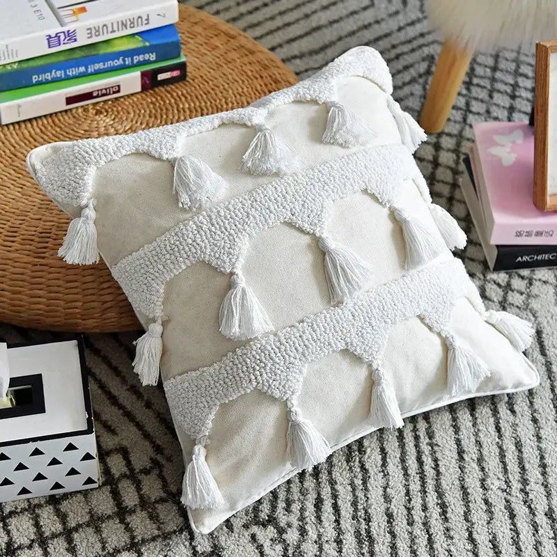 Cream-colored boho ivory tufted tassel cushion cover with white tassels and textured woven bands for living room decor