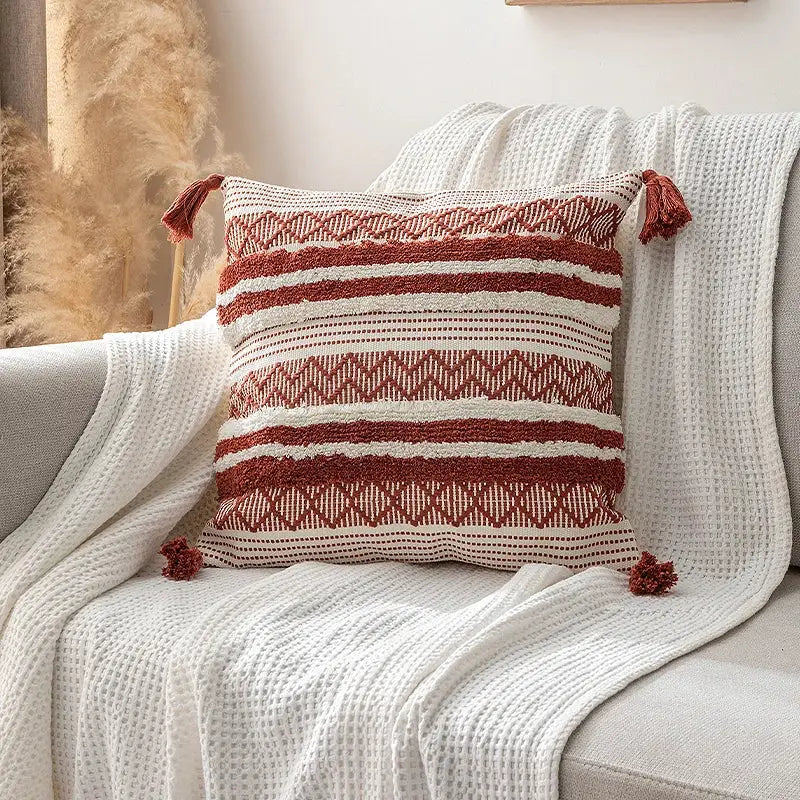 Cozy boho jacquard cushion cover with rust and cream stripes and tassels for decorbites boho jacquard living room decor