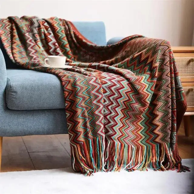 Boho knitted striped throw blanket with multicolored zigzag pattern and fringe detailing for cozy living room decorbites decor