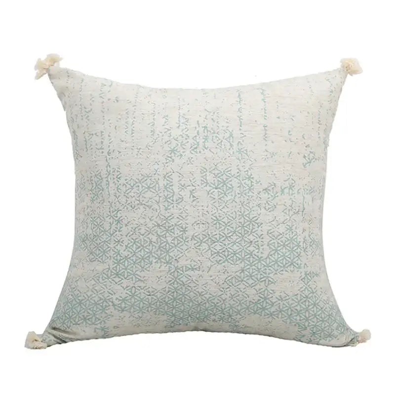Boho light blue and white pillow cover with green tassel pillow design featuring soft fabric and intricate geometric pattern