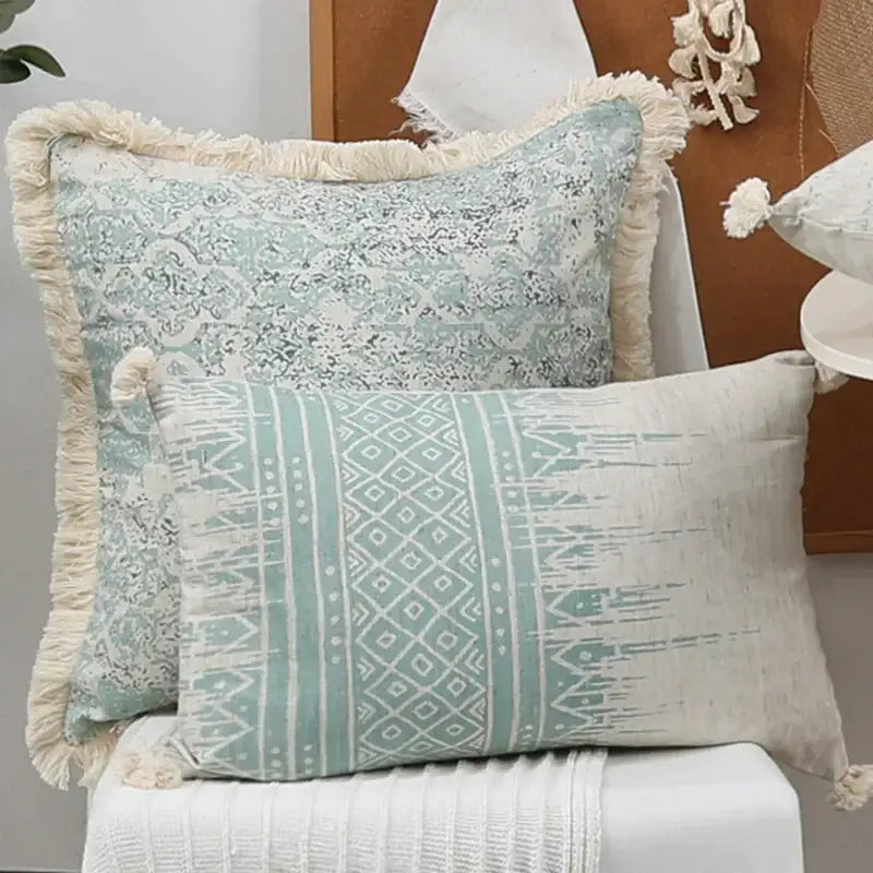 Two rectangular boho pillow covers with green tassel accents in light blue and white pattern for living room decorbites decor