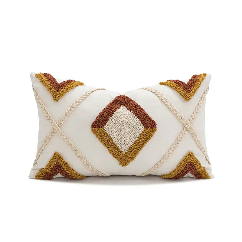 Cream-colored boho loop tufted geometric pillow cover with rust and mustard textured patterns and braided rope accents
