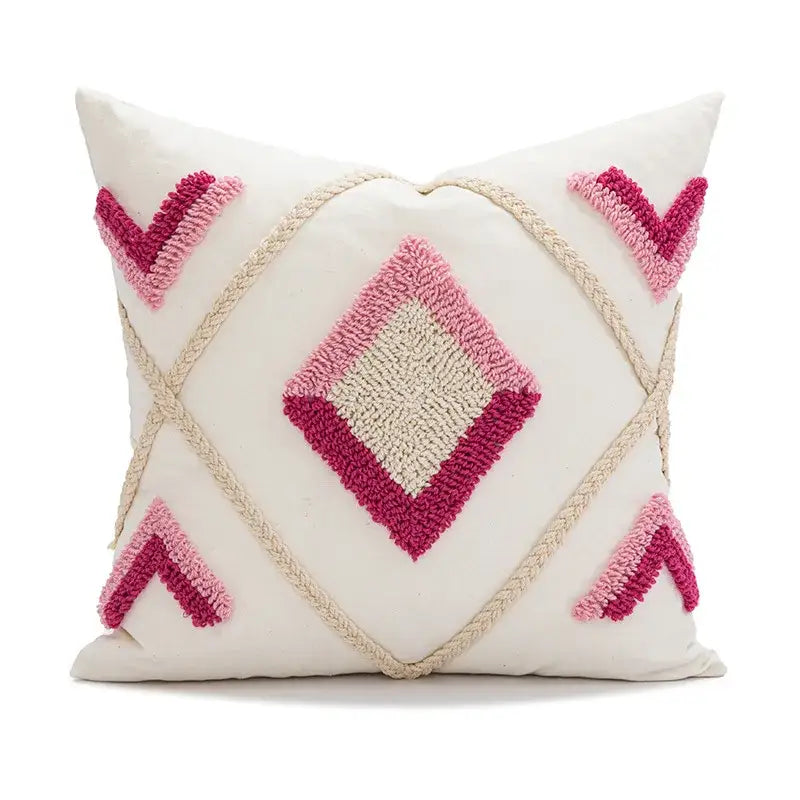 Cream-colored boho loop tufted pillow cover with pink and magenta geometric hooked yarn design for decorbites decor