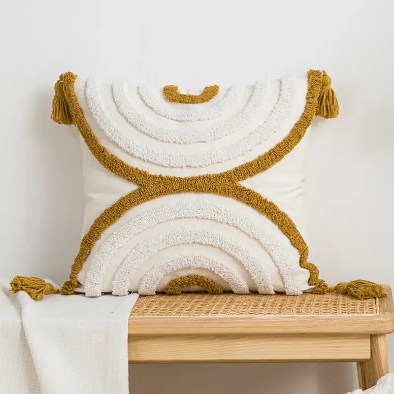 Cream-colored boho loop tufted pillow cover with textured layered rainbow patterns and tassels for bedroom decorbites decor