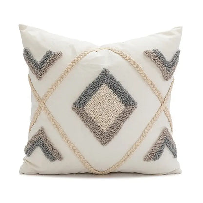 Cream-colored pillow cover with textured gray geometric embroidery and braided rope accents decorbites boho loop tufted