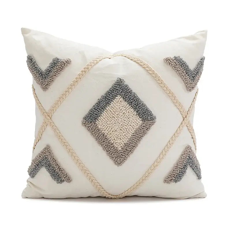 Cream-colored pillow cover with textured gray geometric embroidery and braided rope accents decorbites boho loop tufted